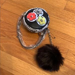 Macy’s wristlet with flowers and Pom Pom